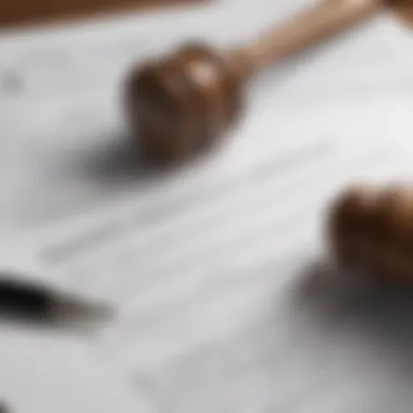 A close-up of a person's hand writing on a document with a gavel beside it